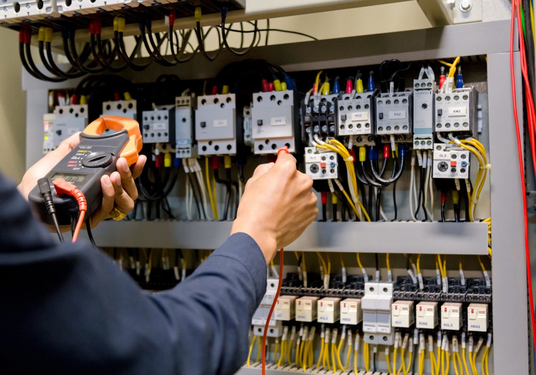 electrician-engineer-work-tester-measuring-voltage-and-current-of-power-electric-line-in-electical-cabinet-control-min
